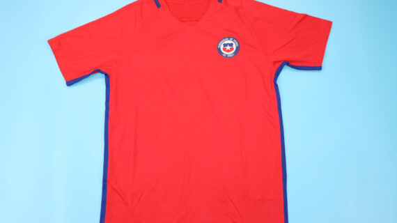 Shirt Front - Chile 2016-2017 Home Short-Sleeve Jersey Throughout the season, Chile maintained a formidable presence, showcasing their trademark grit and determination in every match they contested. Led by the experienced and inspirational Claudio Bravo, the team exhibited resilience and skill, proving themselves as worthy contenders in every competition they entered. In the Copa América Centenario, held in 2016 to commemorate the tournament's centennial anniversary, Chile embarked on a journey to defend their title. Facing stiff competition from formidable opponents, including perennial rivals Argentina, Chile once again displayed their mettle in a thrilling final showdown. Despite their historic inability to defeat Argentina in regular time, Chile triumphed in a tense penalty shootout, clinching their second consecutive Copa América title and etching their name in the annals of footballing history. Beyond the Copa América, Chile continued to assert their dominance in various international competitions, with notable performances from key players such as Alexis Sánchez, Arturo Vidal, and Eduardo Vargas. Their unwavering commitment to excellence and their never-say-die attitude propelled them to success, earning the admiration of fans worldwide and solidifying their status as a footballing powerhouse in South America. As the season drew to a close, Chile emerged as one of the continent's most formidable teams, with their sights set on future triumphs and further glory on the international stage.